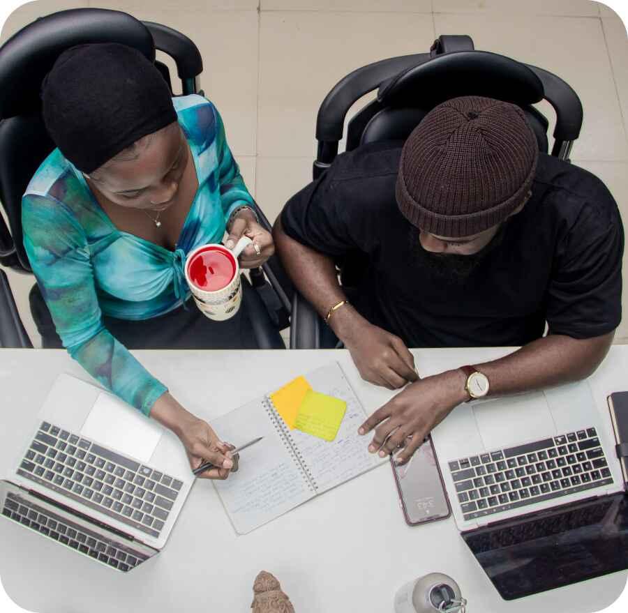 happy-young-african-american-speaker-pointing-computer-screen-with-diagrams