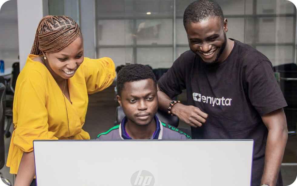 happy-young-african-american-speaker-pointing-computer-screen-with-diagrams